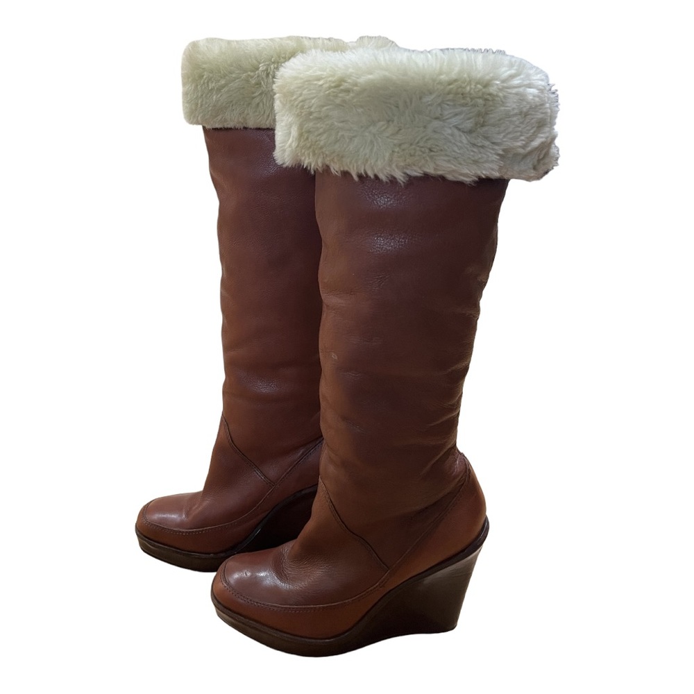 Michael Kors knee high leather wedge boots with faux fur lining.